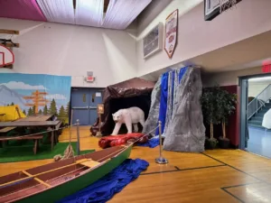 Stage backdrop with vibrant VBS theme artwork in Columbia, MD