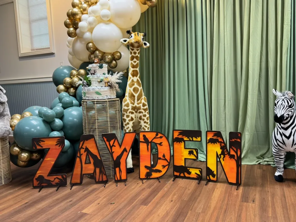 Full room view of baby shower decor at Casey Community Center in Gaithersburg, MD