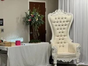 White throne chair with floral arrangements, Sweet 16 party decor in Frederick, MD