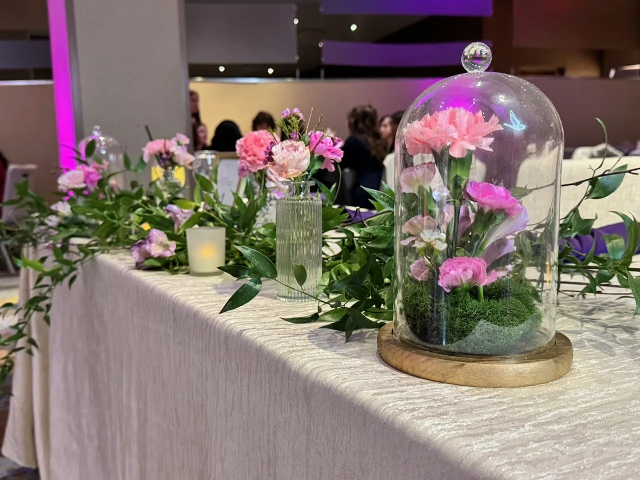 Balloon garland in blush tones at the quinceañera entrance