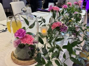 Custom quinceañera sign surrounded by flowers in BWI, MD