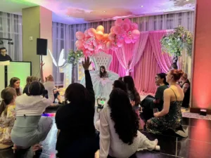 Guest tables with glowing centerpieces at the quinceañera in BWI