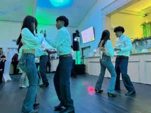 Two young couples dancing at Jimena's quinceañera celebration in Silver Spring, MD