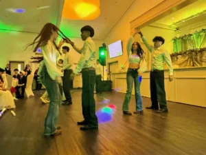 Young couples dancing at Jimena's quinceañera celebration in Silver Spring, MD