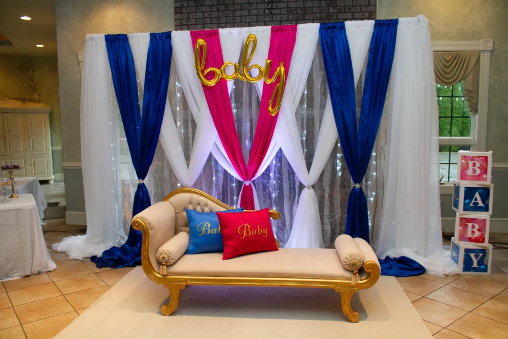 Blue, white and red draped fabric backdrop with gold 'Oh Baby' sign, baby shower decor at Cortland Mansion, Hagerstown MD