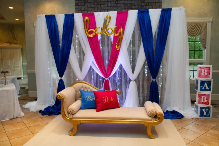 Blue, white and red draped fabric backdrop with gold 'Oh Baby' sign, baby shower decor at Cortland Mansion, Hagerstown MD